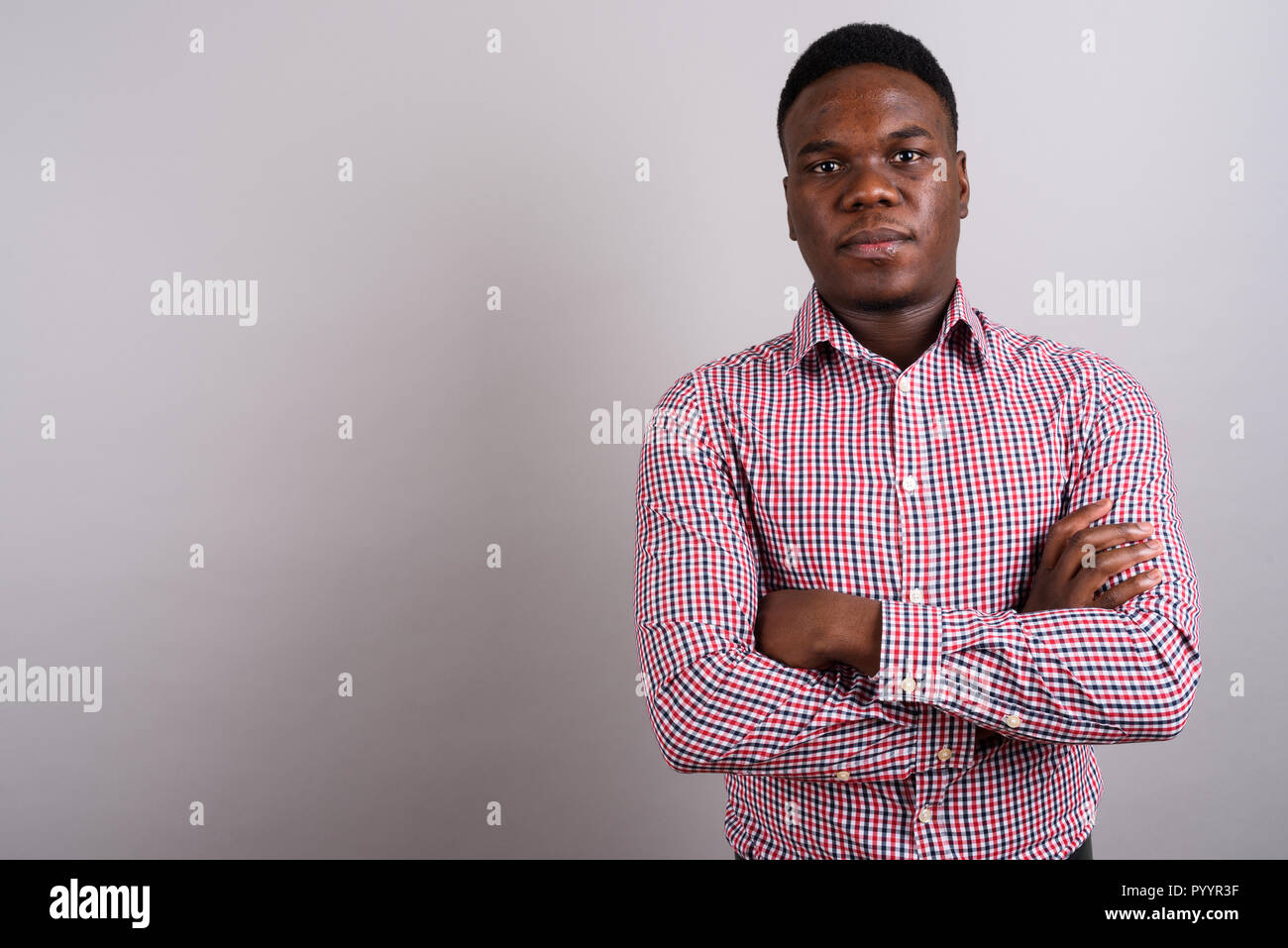African american man standing arms hi-res stock photography and images ...