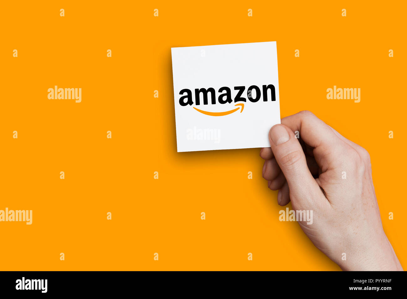 LONDON, UK October 30th 2018 Hand holding Amazon logo. Amazon is the