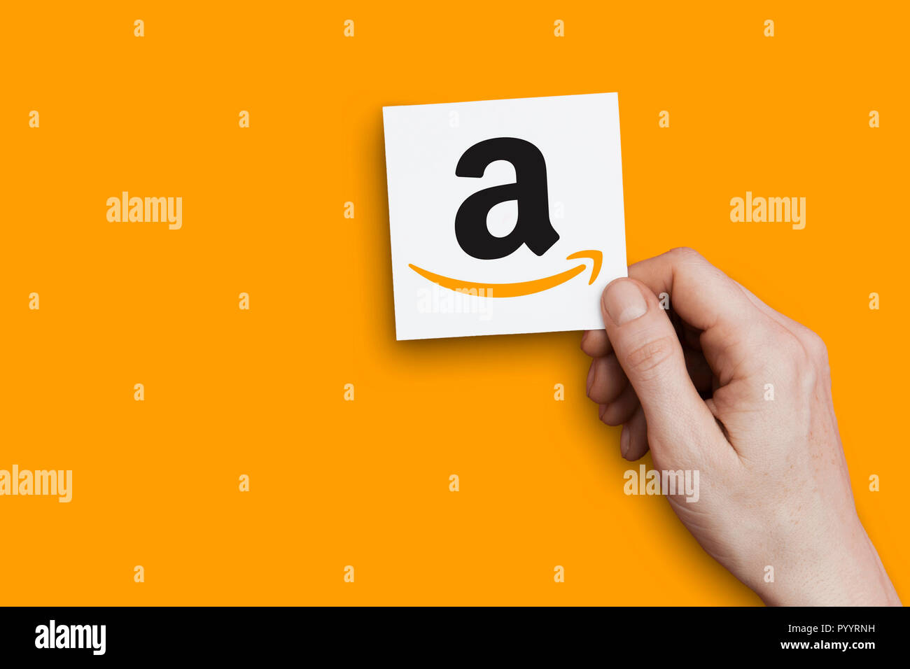 LONDON, UK October 30th 2018 Hand holding Amazon logo. Amazon is the