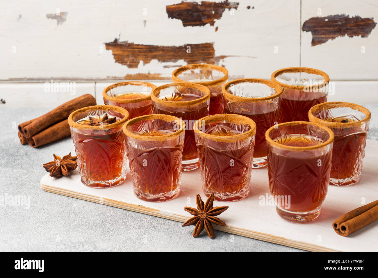 Mulled wine cider in small stacks with cinnamon and anise. The concept ...