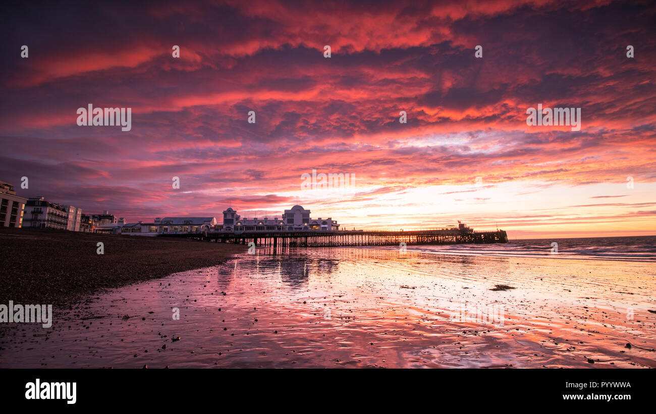 A Bright red Sunrise at south Parade Pier, Southsea, Portsmouth, Hampshire Stock Photo