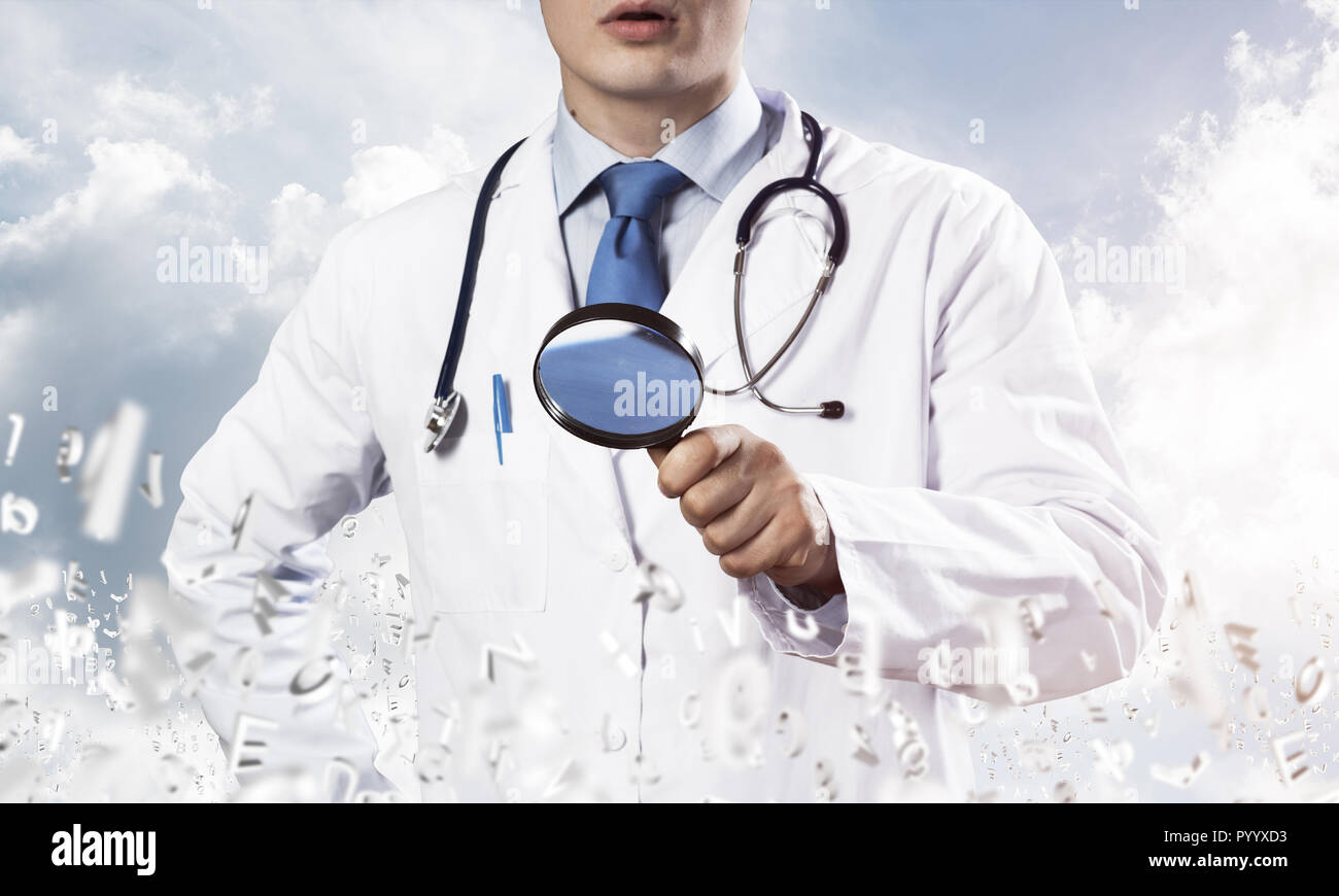 Doctor searching your diseases Stock Photo - Alamy