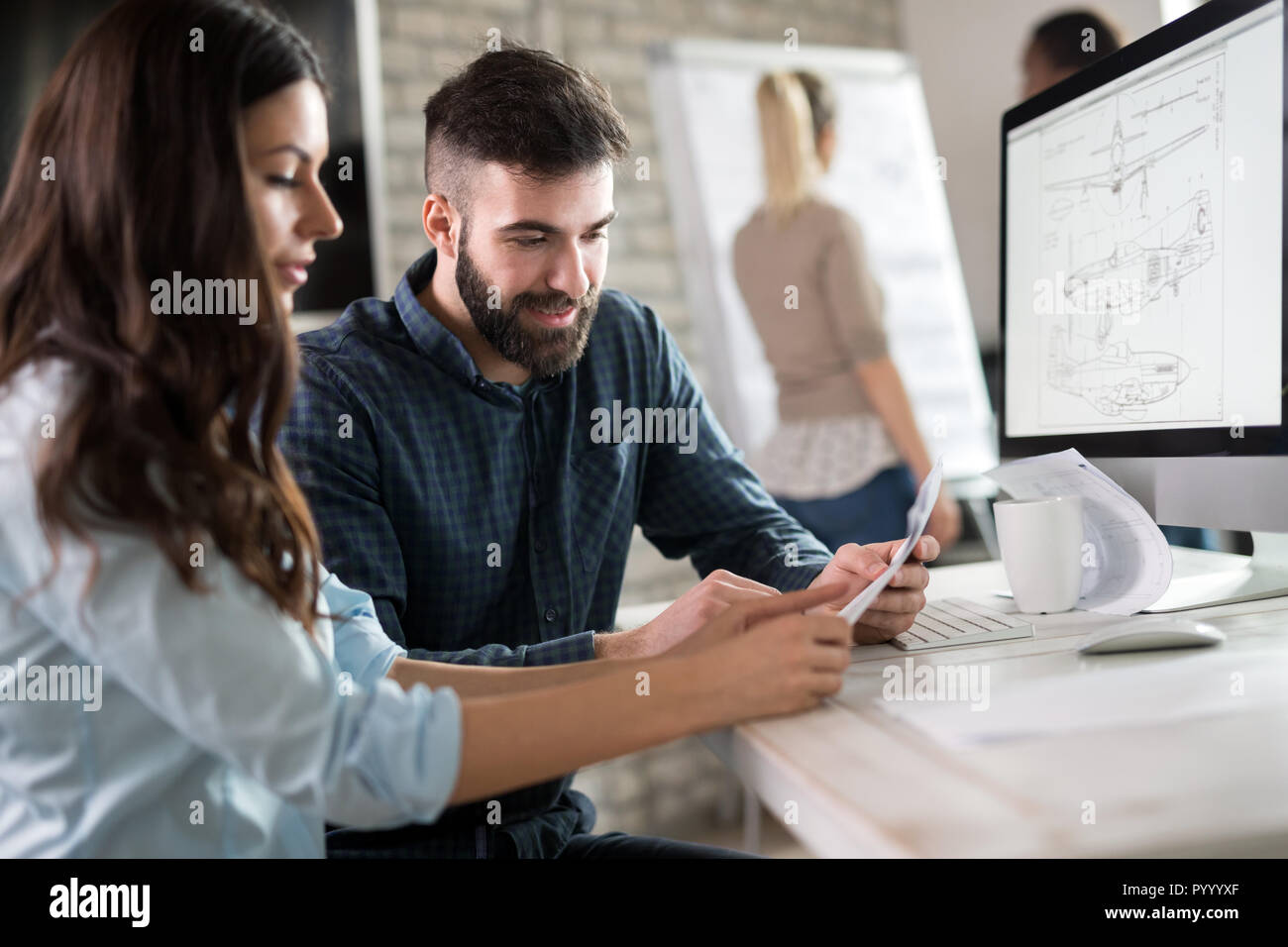 Young architects working on project in office Stock Photo