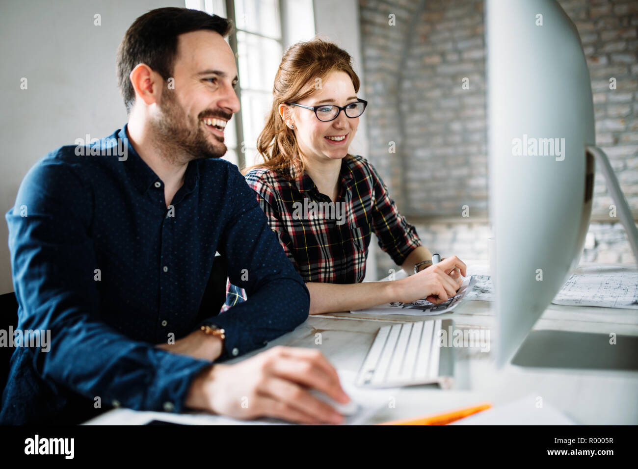 Young architects working on project in office Stock Photo