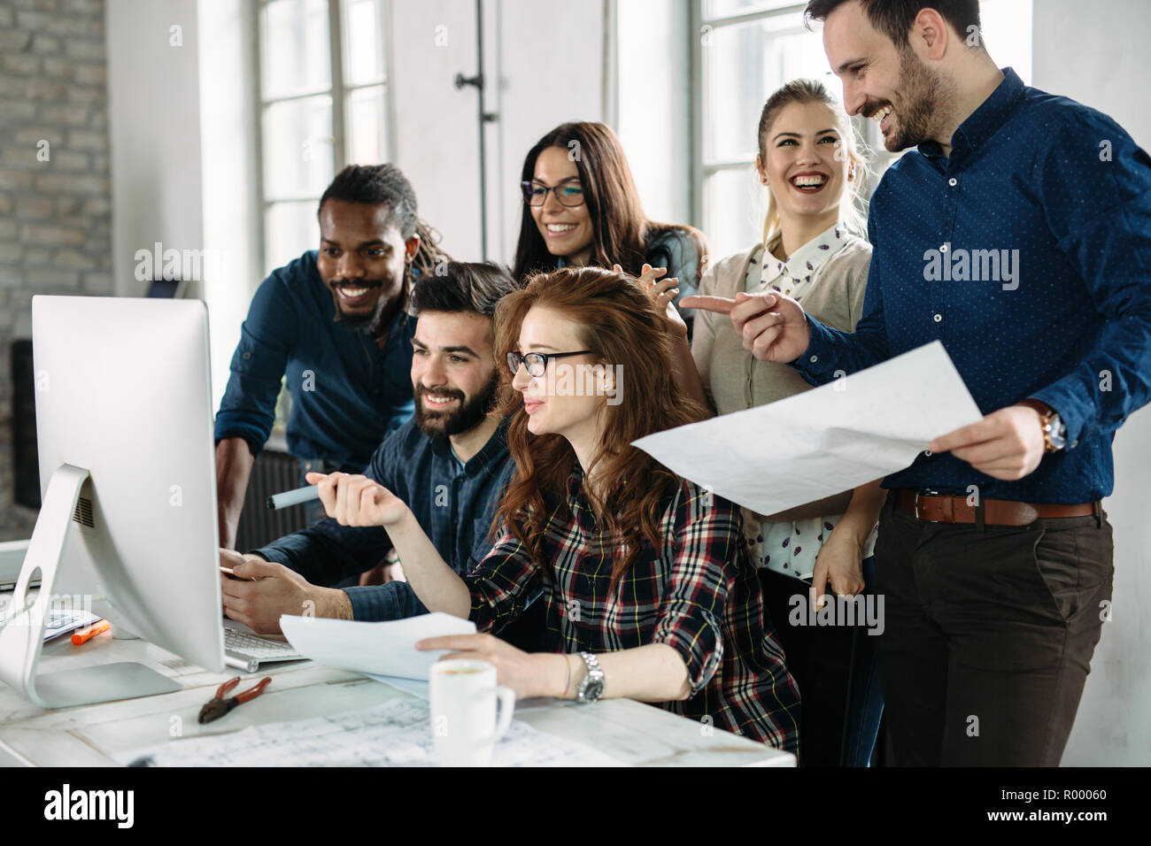 Young architects working on project in office Stock Photo