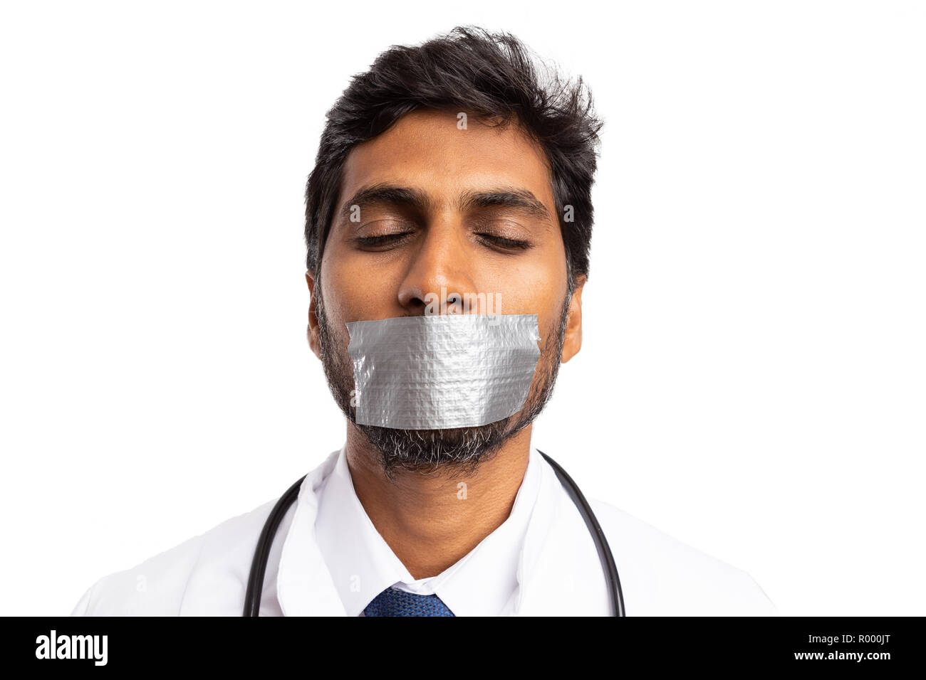 Indian medic silenced with mouth being taped as do not tell professional secret isolated on white Stock Photo