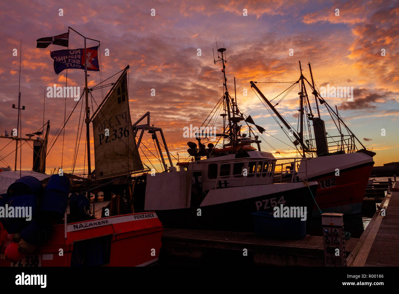 Newlyn, Cornwall, UK, 31st October 2018. Stunning red skies over the fishing port of Newlyn this morning. Credit: Mike Newman/Alamy Live News. Stock Photo