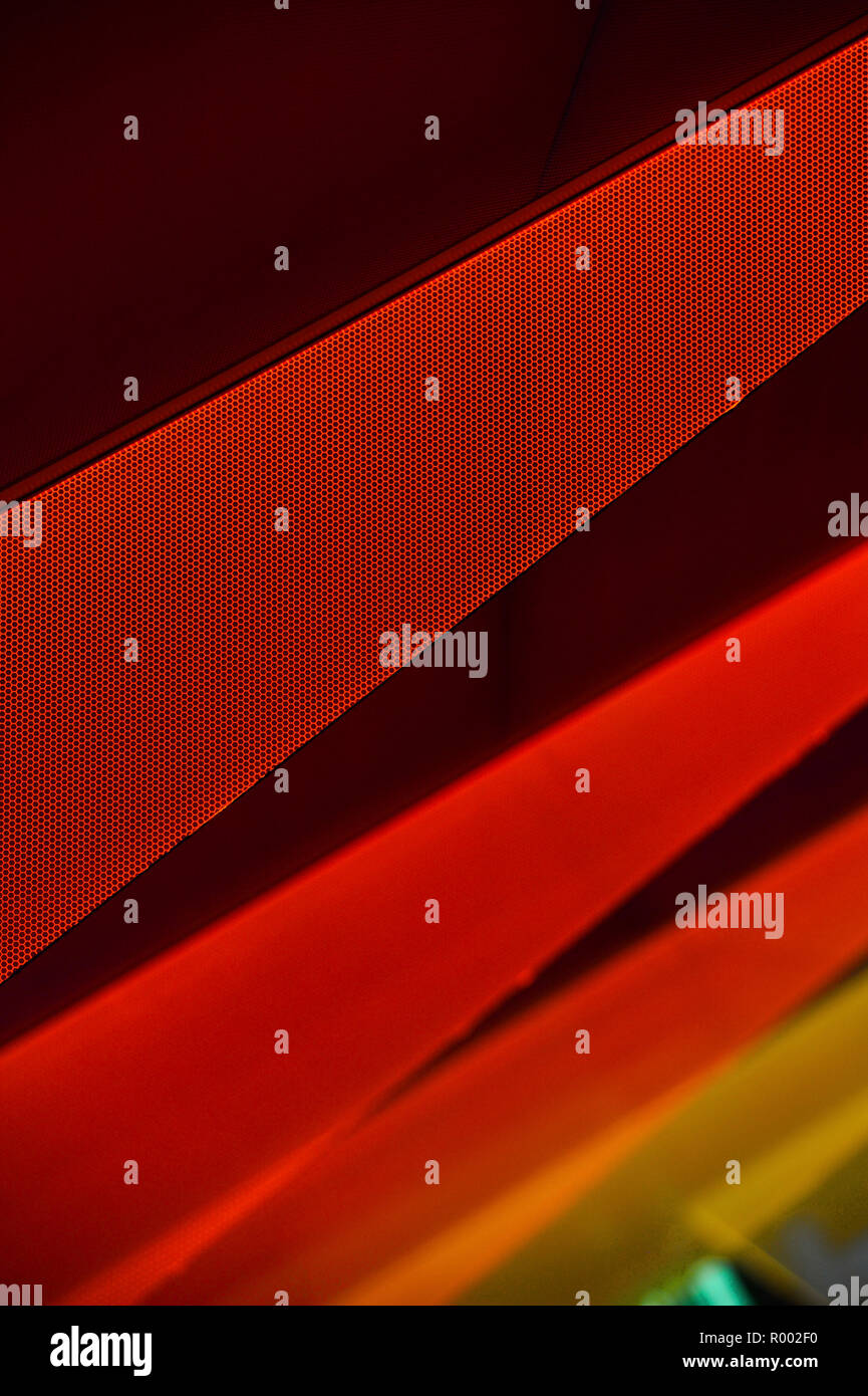 Red, orange and yellow triangular shapes on black background. Stock Photo