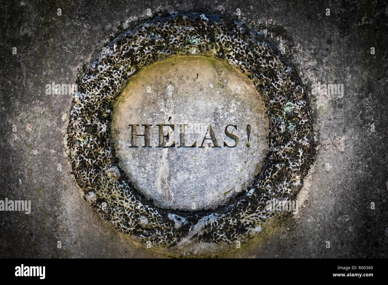 stone floral wreath with the inscription:'helas!' Stock Photo