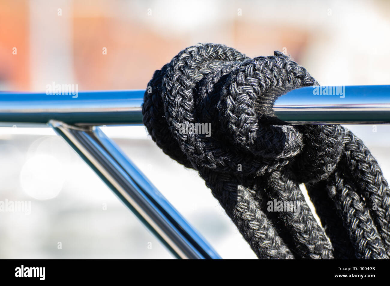 Boat Mooring ropes tied over yachts guard rail Stock Photo Alamy