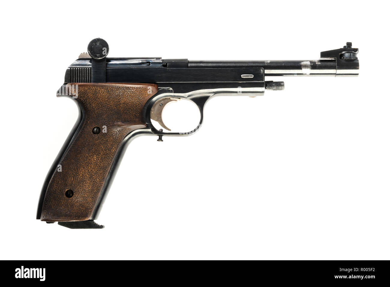 isolated used old sports pistol on a white background Stock Photo - Alamy