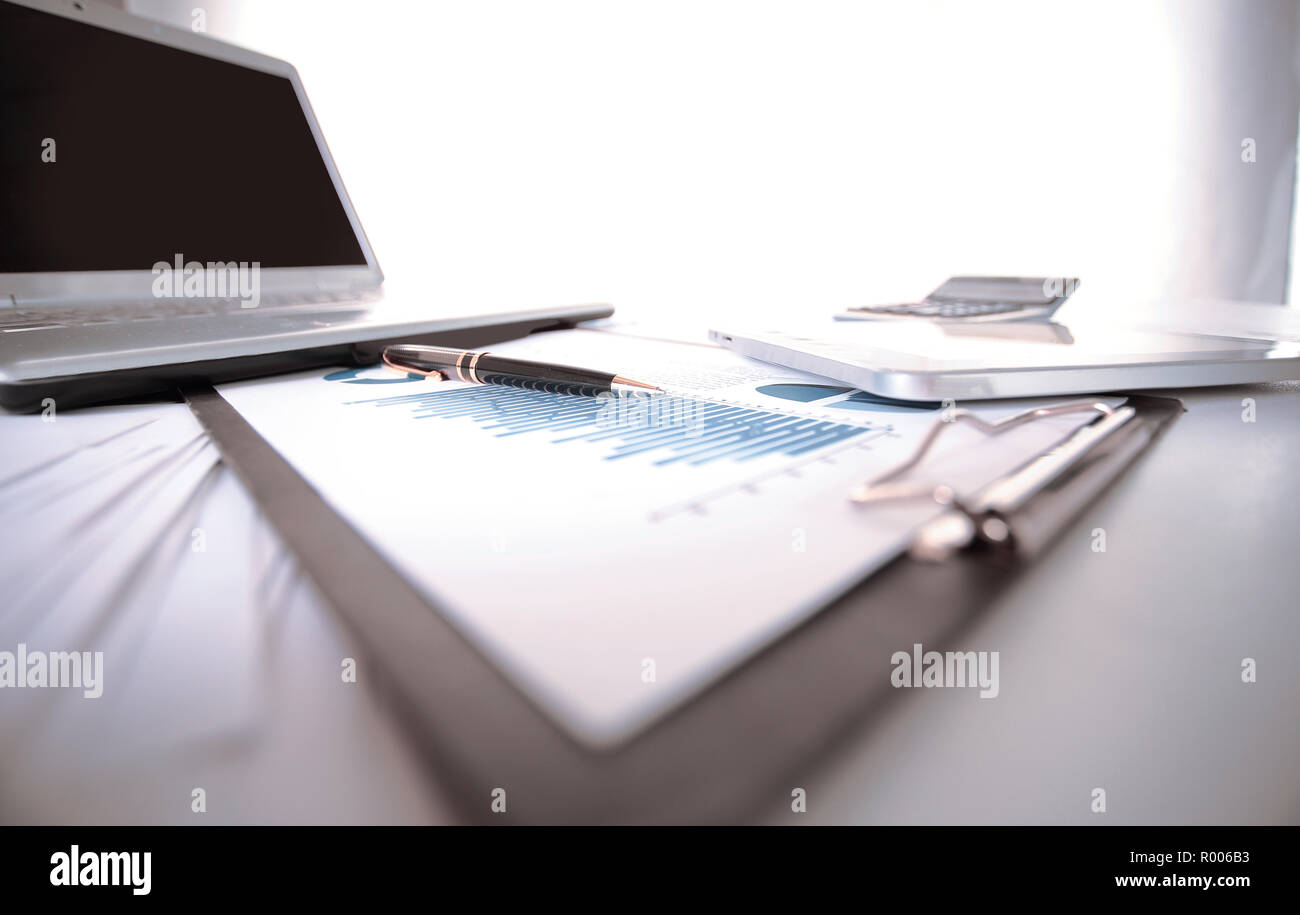 business background. financial charts on the desktop Stock Photo