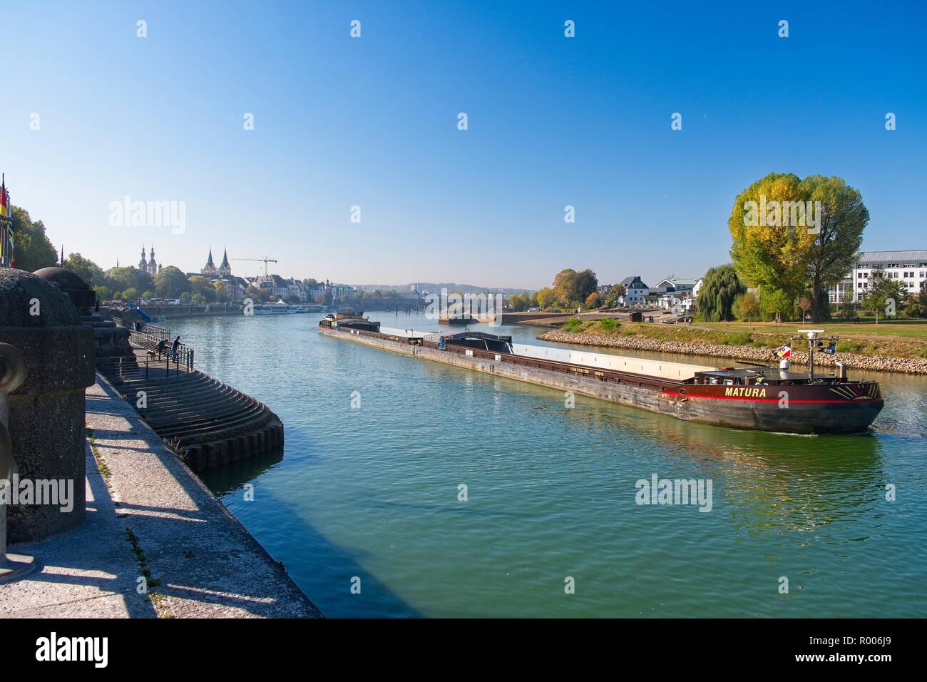 DOUBLE LENGTH BARGE EMERGING FROM THE MOSEL ON TO THE RIVER RHINE, KOBLENZ, GERMANY Stock Photo