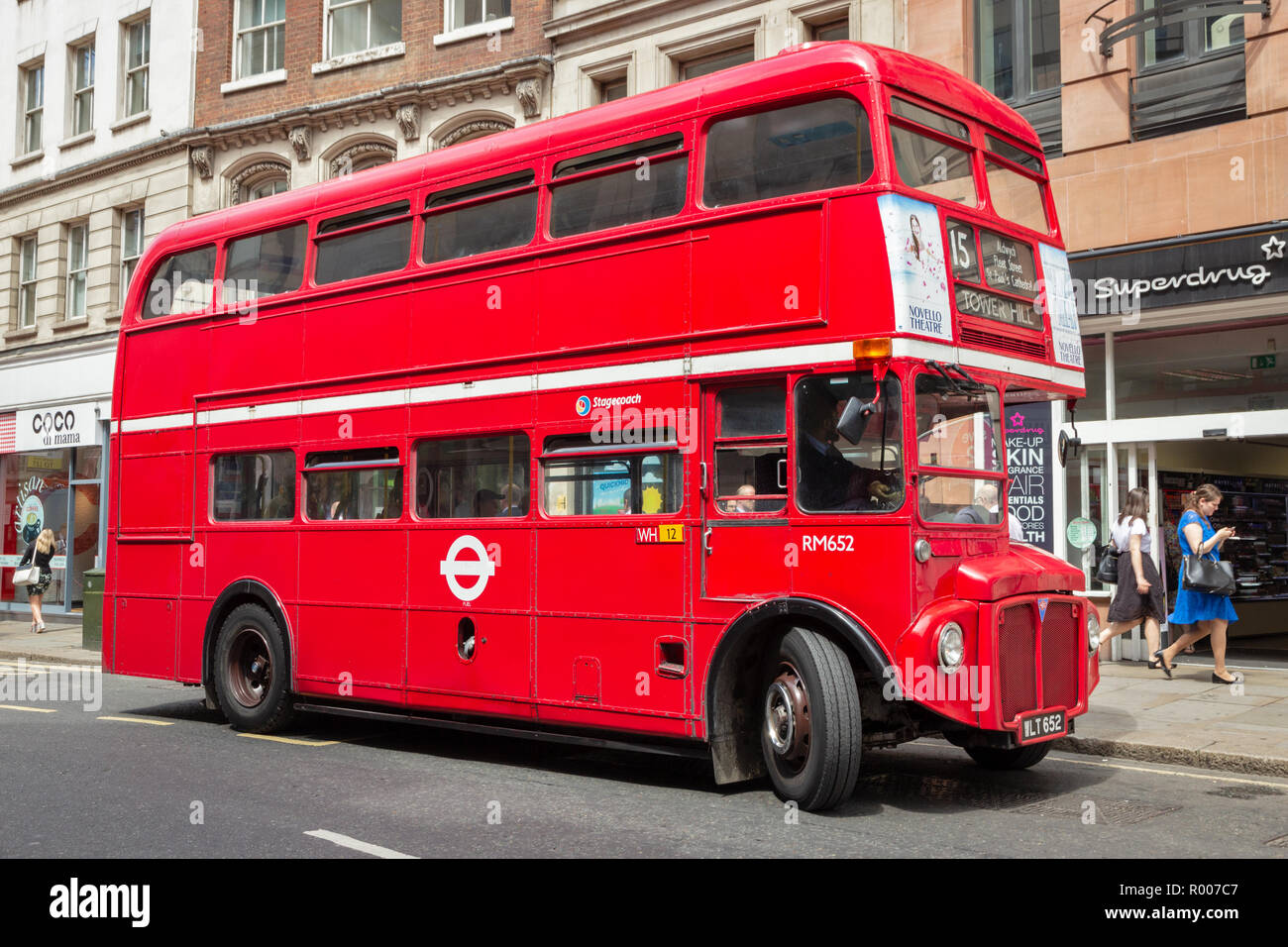 LONDON - JUL 02, 2015: Vintage red double decker bus in a street of London, UK. Stock Photo