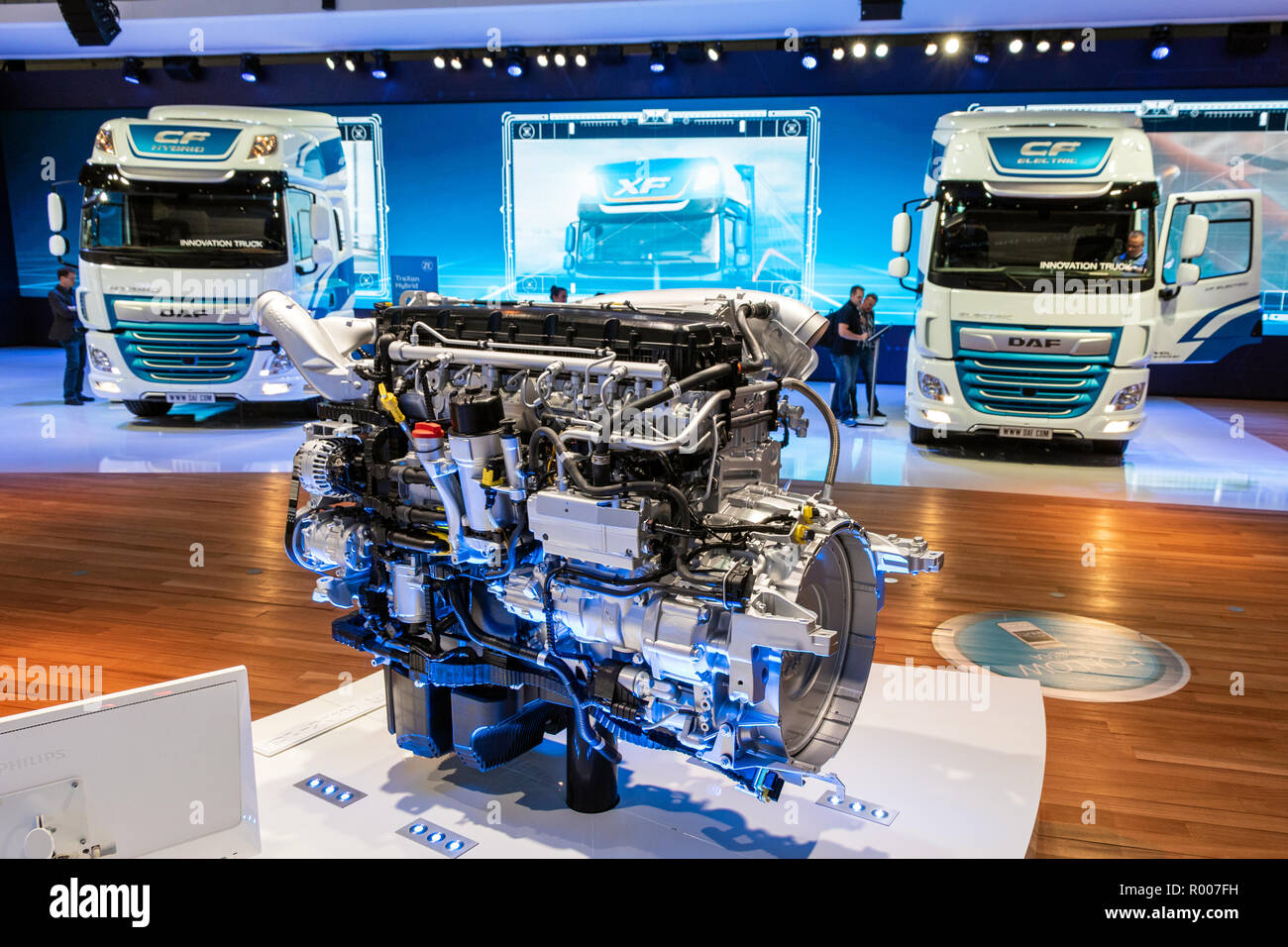 HANNOVER, GERMANY - SEP 27, 2018: Modern truck engine in front of new DAF trucks at the Hannover IAA Commercial Vehicles Motor Show. Stock Photo