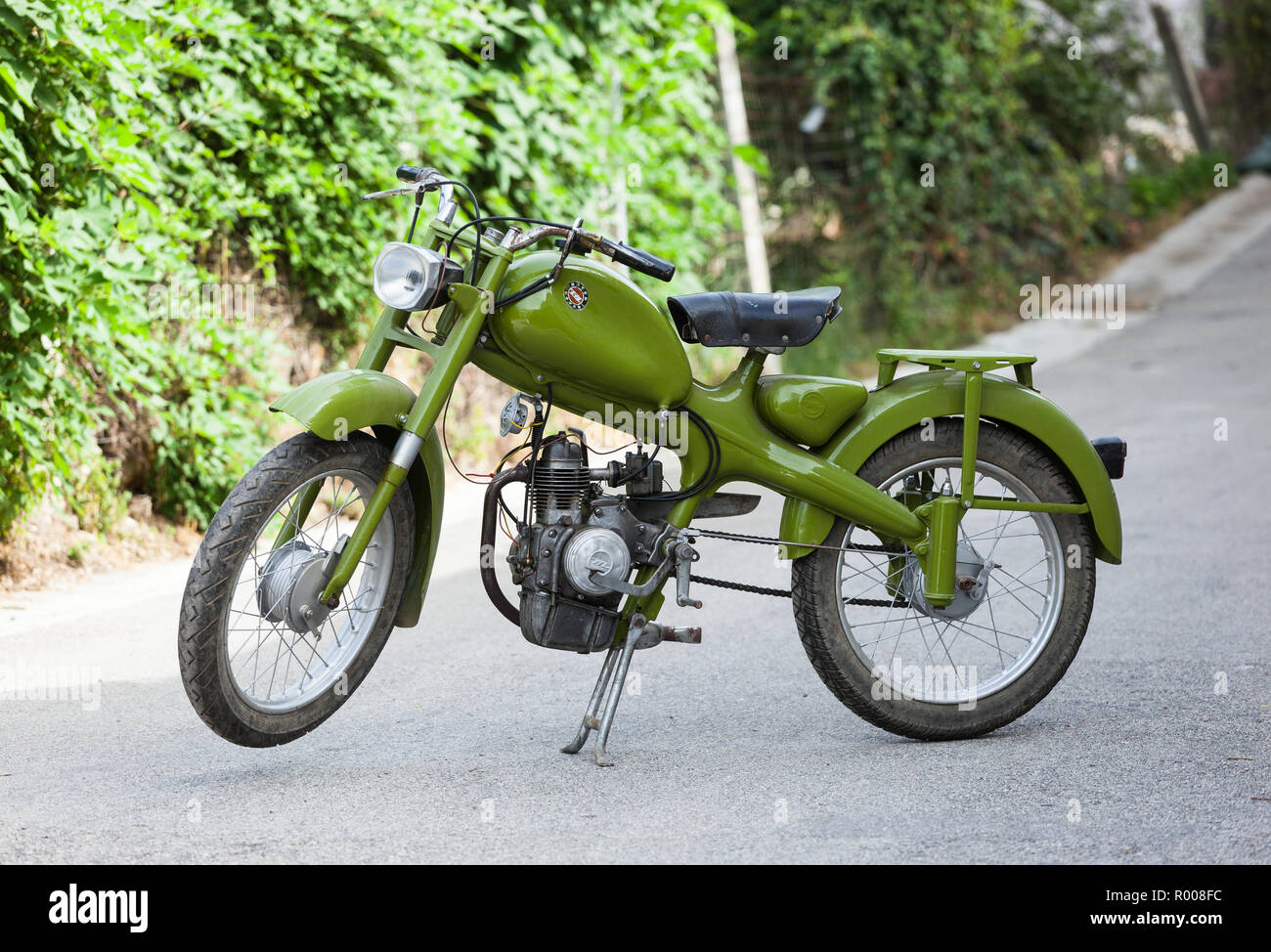 Teano, Italy - July 29, 2012: vintage Italian moped Motom 48, low fuel consumption four-stroke engine. Motom was a Milanese motorcycle company active  Stock Photo