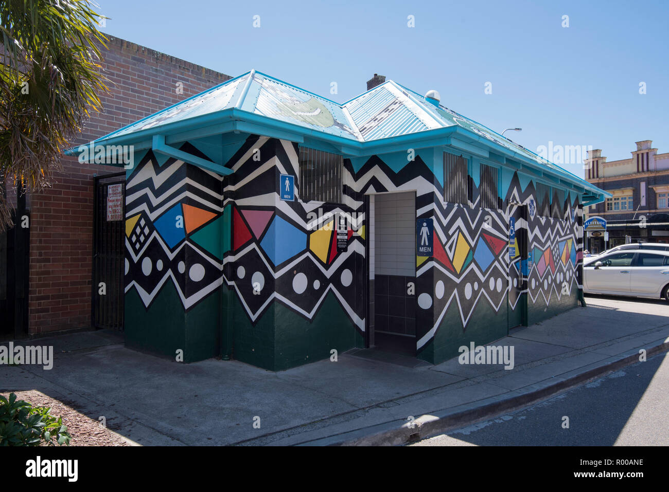 A public toilet restroom with a Jenny Kee mural covering its walls and roof on Govetts Leap road in Blackheath New South Wales, Austalia Stock Photo