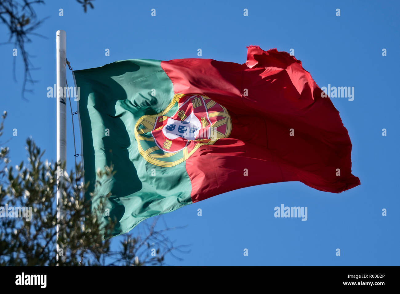 Portuguese flag waving at the Castelo de Sao Jorge, Lisbon, Portugal. Stock Photo