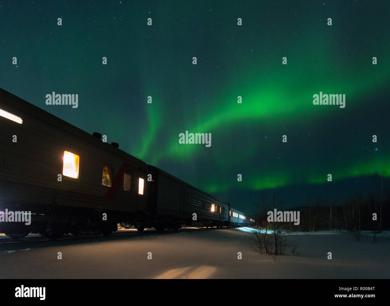 train and aurora borealis over the tundra, Russia Stock Photo