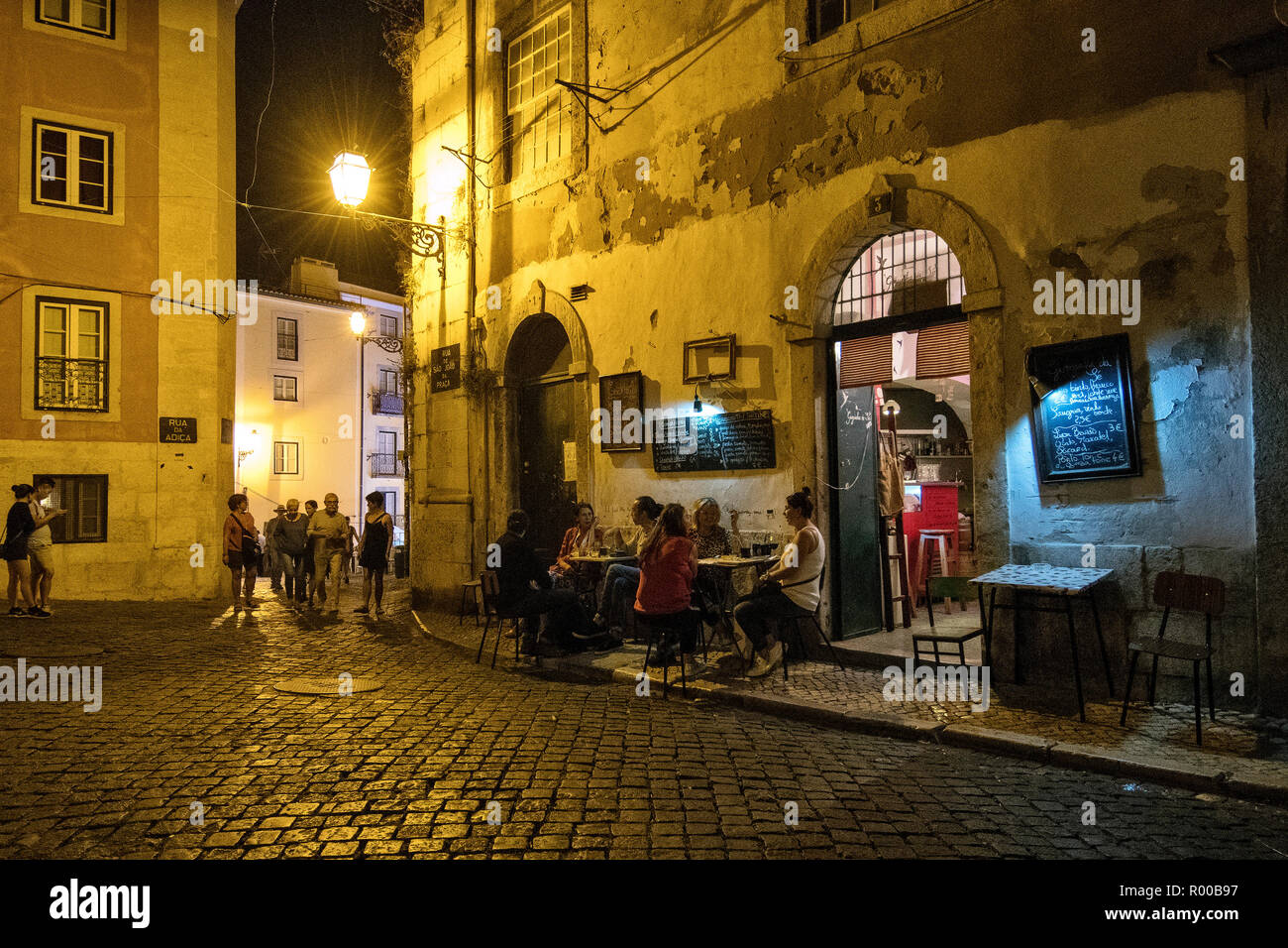 Nightlife with bar in the Alfama district, Lisbon, Portugal. Stock Photo