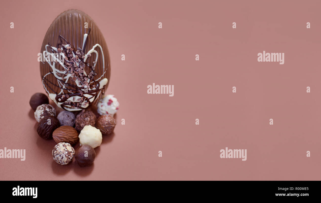 Large chocolate egg composition with hand picked chocolates truffles