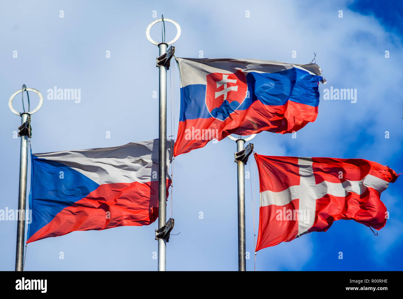 Flags of European countries on flagpoles against the blue sky Stock ...