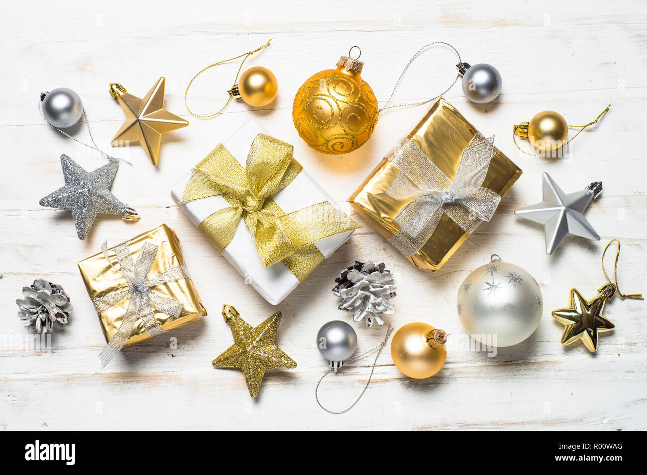 Gold And Silver Christmas Present Box And Decorations On White