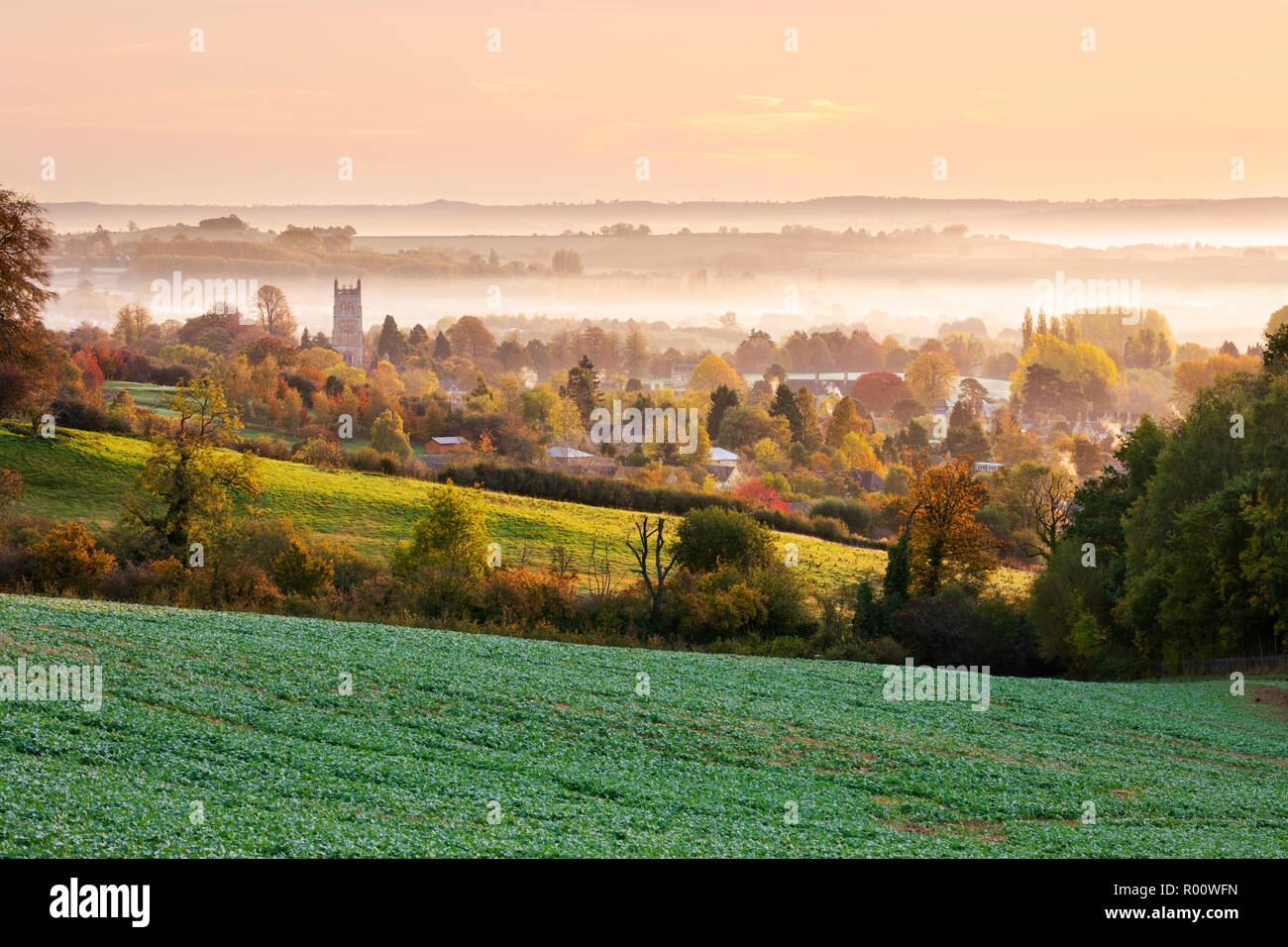 St James' church and misty autumnal cotswold landscape at sunset, Chipping Campden, Cotswolds, Gloucestershire, England, United Kingdom, Europe Stock Photo