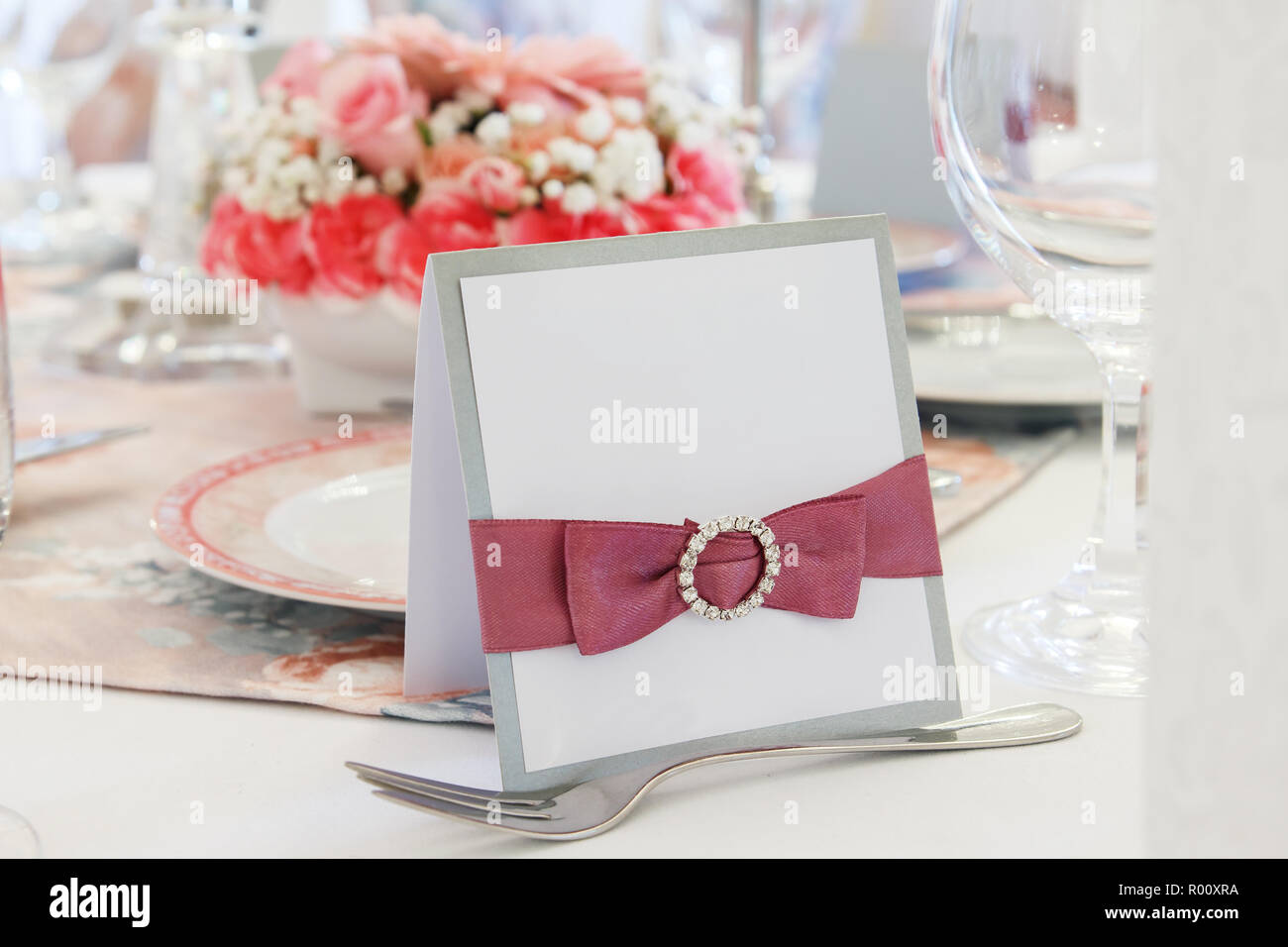 Ornate table name card with pink ribbon and place for your text Stock ...