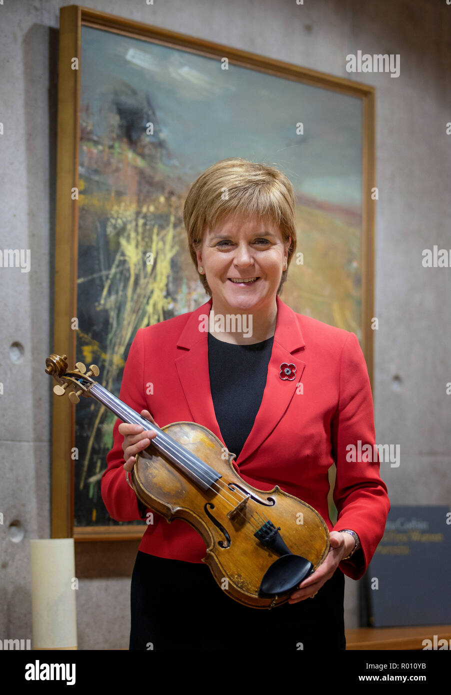 First Minister Nicola Sturgeon takes a closer look at the Wilfred Owen violin during a meeting with the organisers of the #iPlay4Peace crowdsourced world online concert which will take place on the afternoon of Armistice Day. Stock Photo