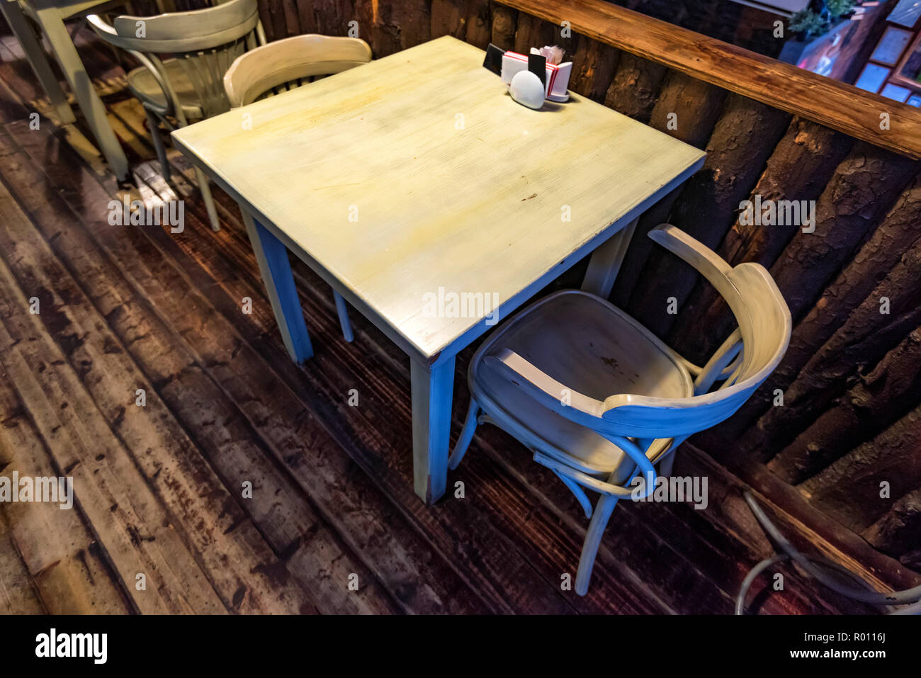 Small wooden table for two in restaurant Stock Photo Alamy
