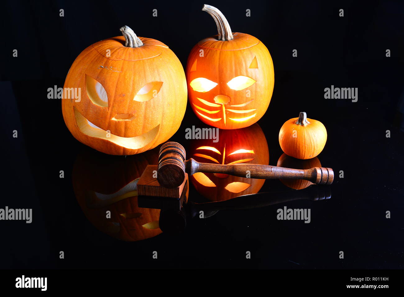 Carved and uncarved pumpkins with a custom hand turned gavel plus sound block. Stock Photo