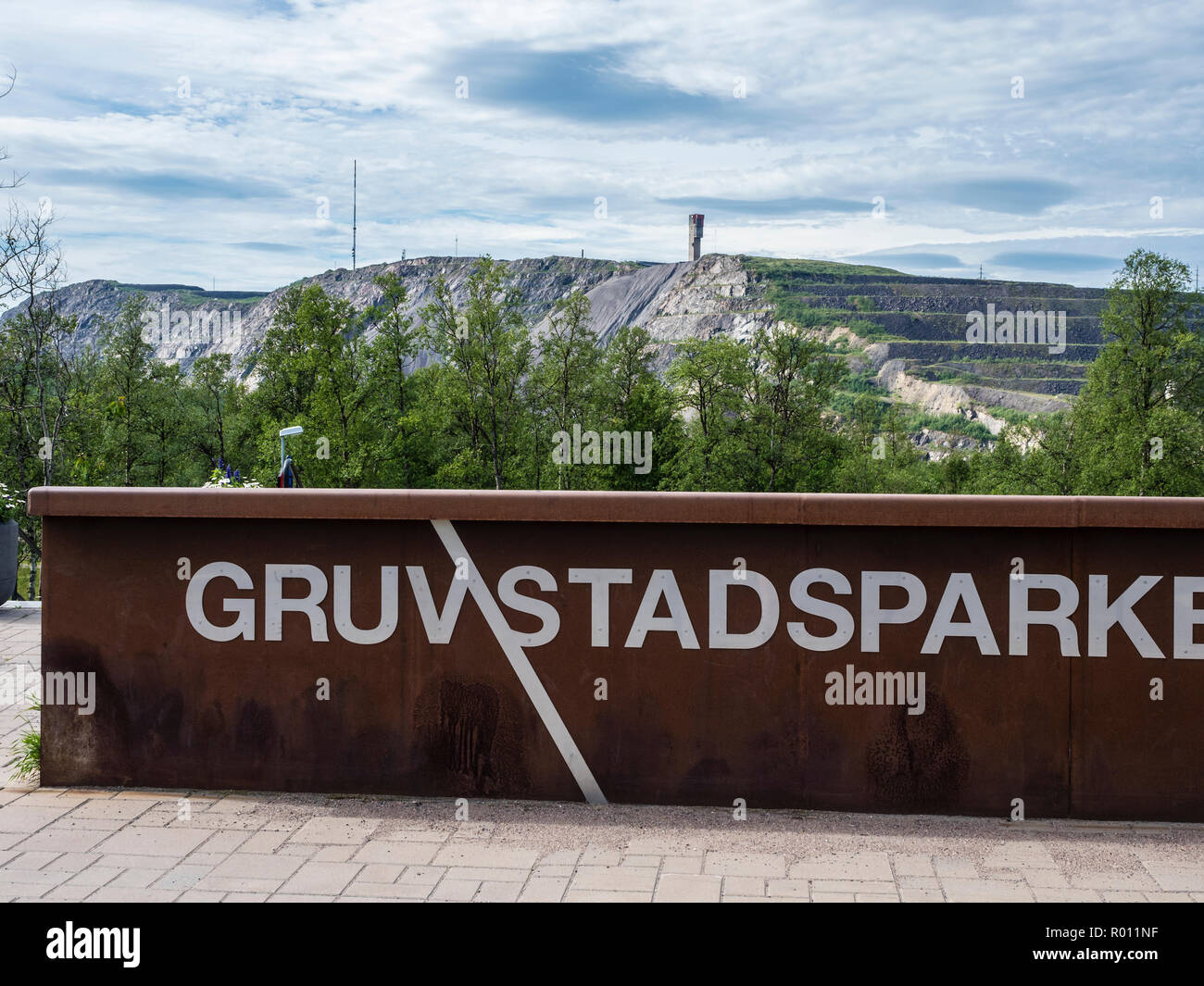 Gruvstadparken, park in Kiruna in view of mining area in the background, Kiruna, Sweden Stock Photo