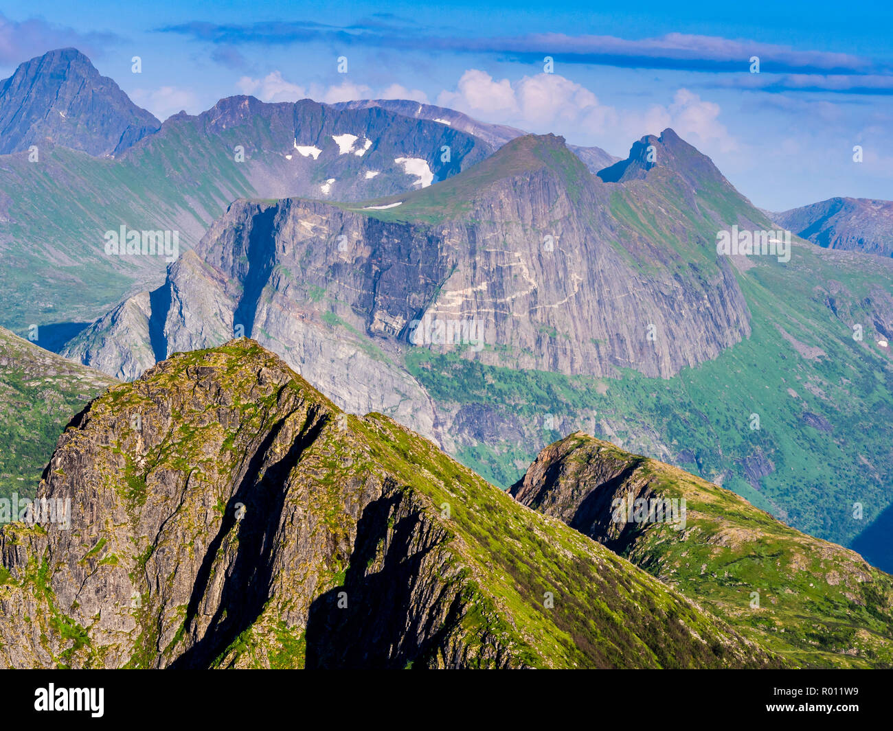 View while hiking up to Husfjell, mountains Litjebrusen and Storbrusen,  above fjord Steinfjord, rock formations, colored banding, Senja, Troms,  Norwa Stock Photo - Alamy