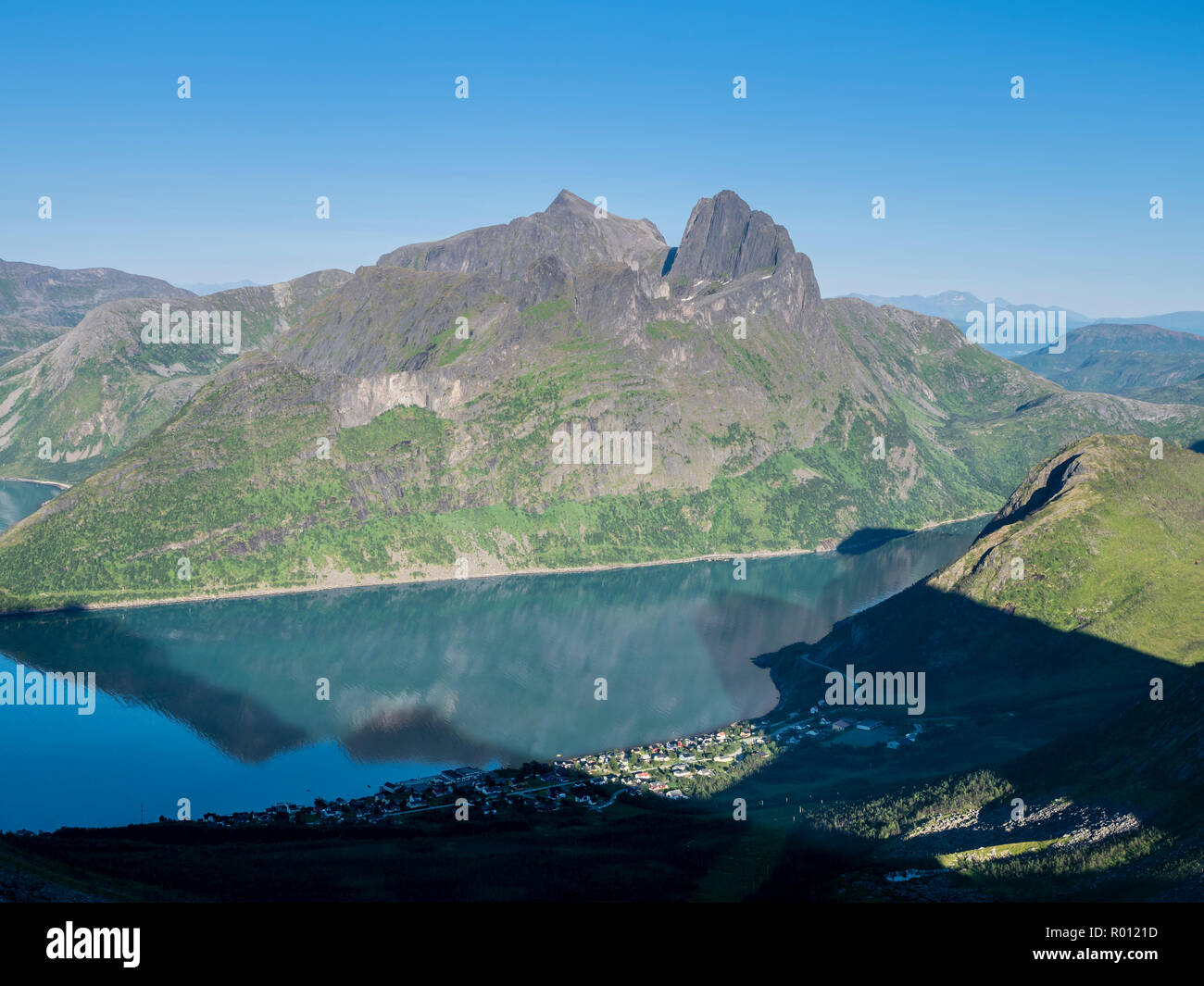 View over village Fjordgard while hiking up to mountain Hesten, peak Keipen in the back, island Senja, Troms, Norway Stock Photo