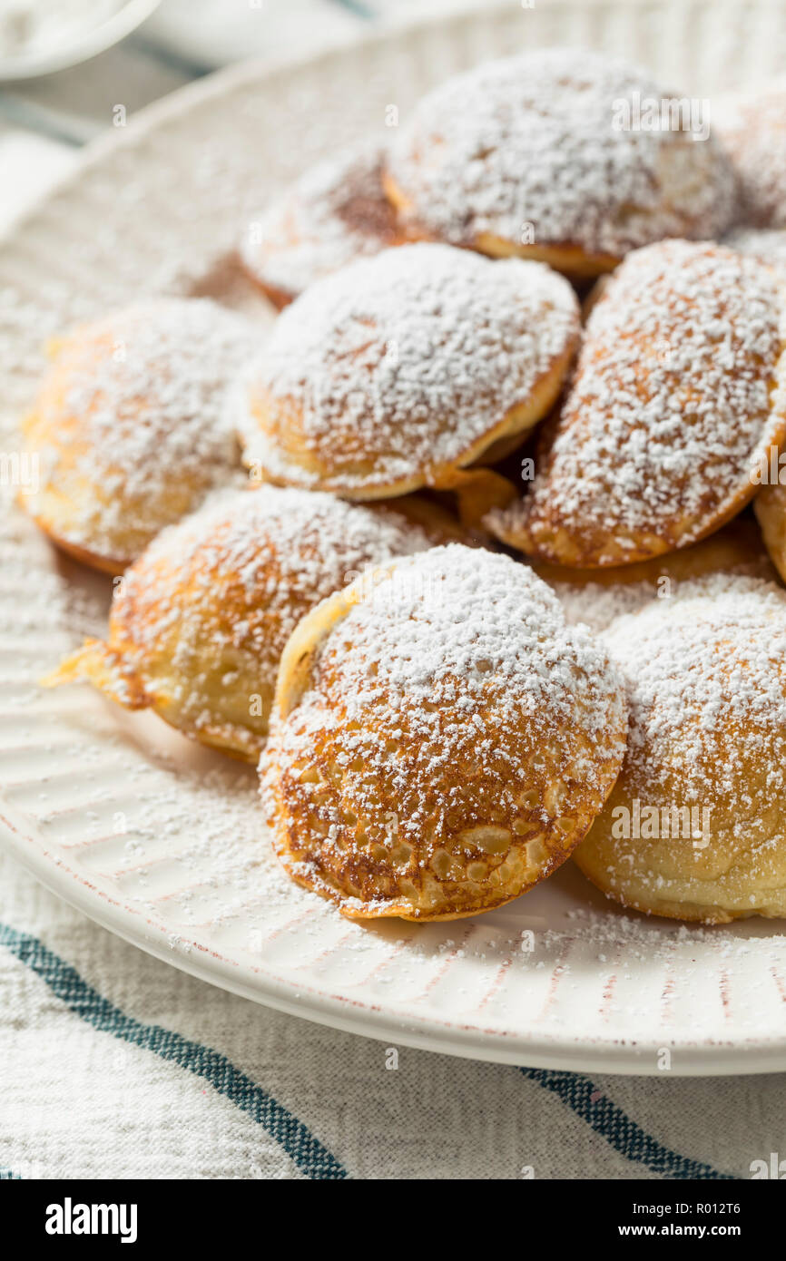 https://c8.alamy.com/comp/R012T6/homemade-dutch-poffertjes-pancakes-with-powdered-sugar-R012T6.jpg