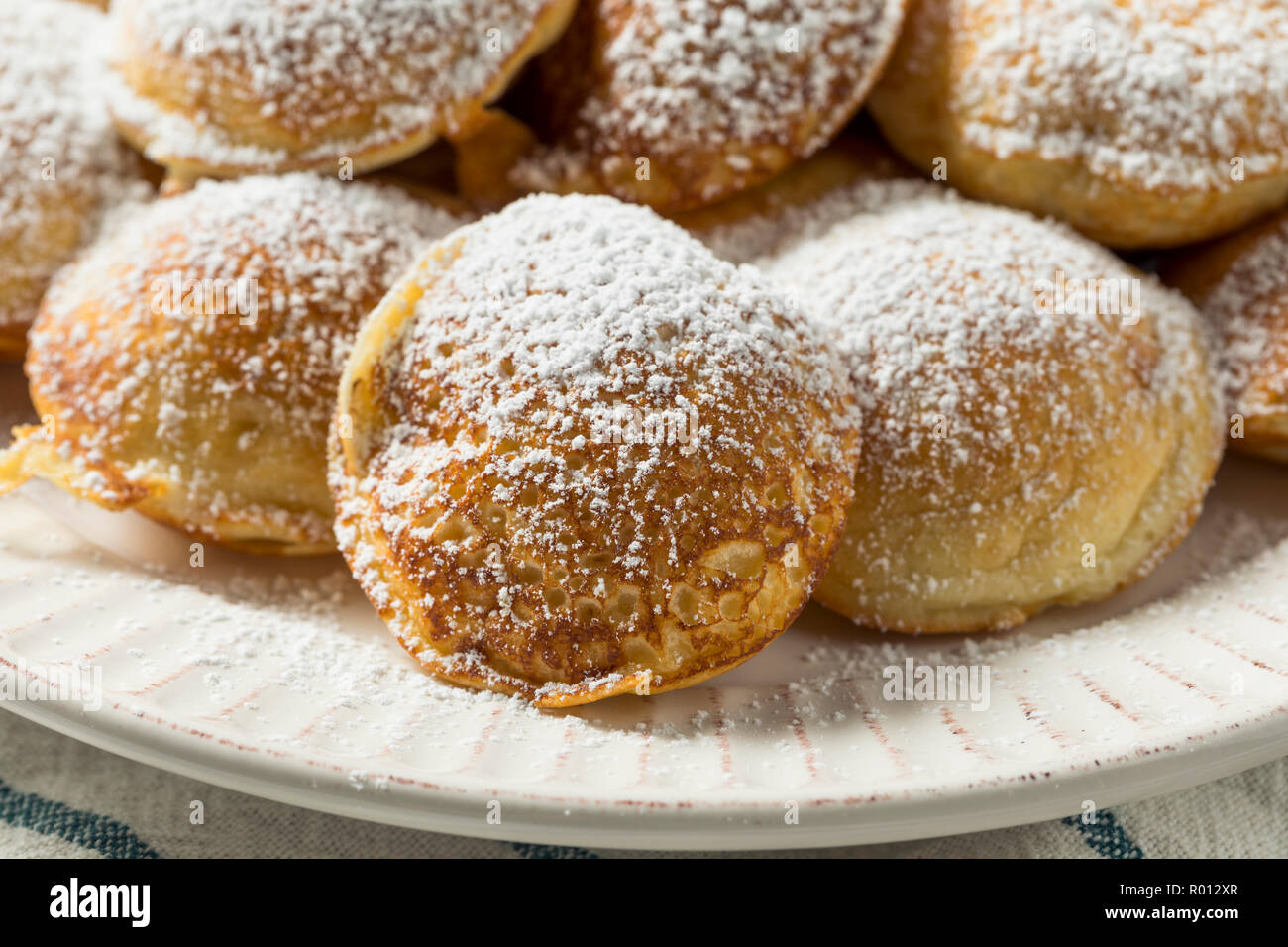 Homemade Dutch Poffertjes Pancakes with Powdered Sugar Stock Photo