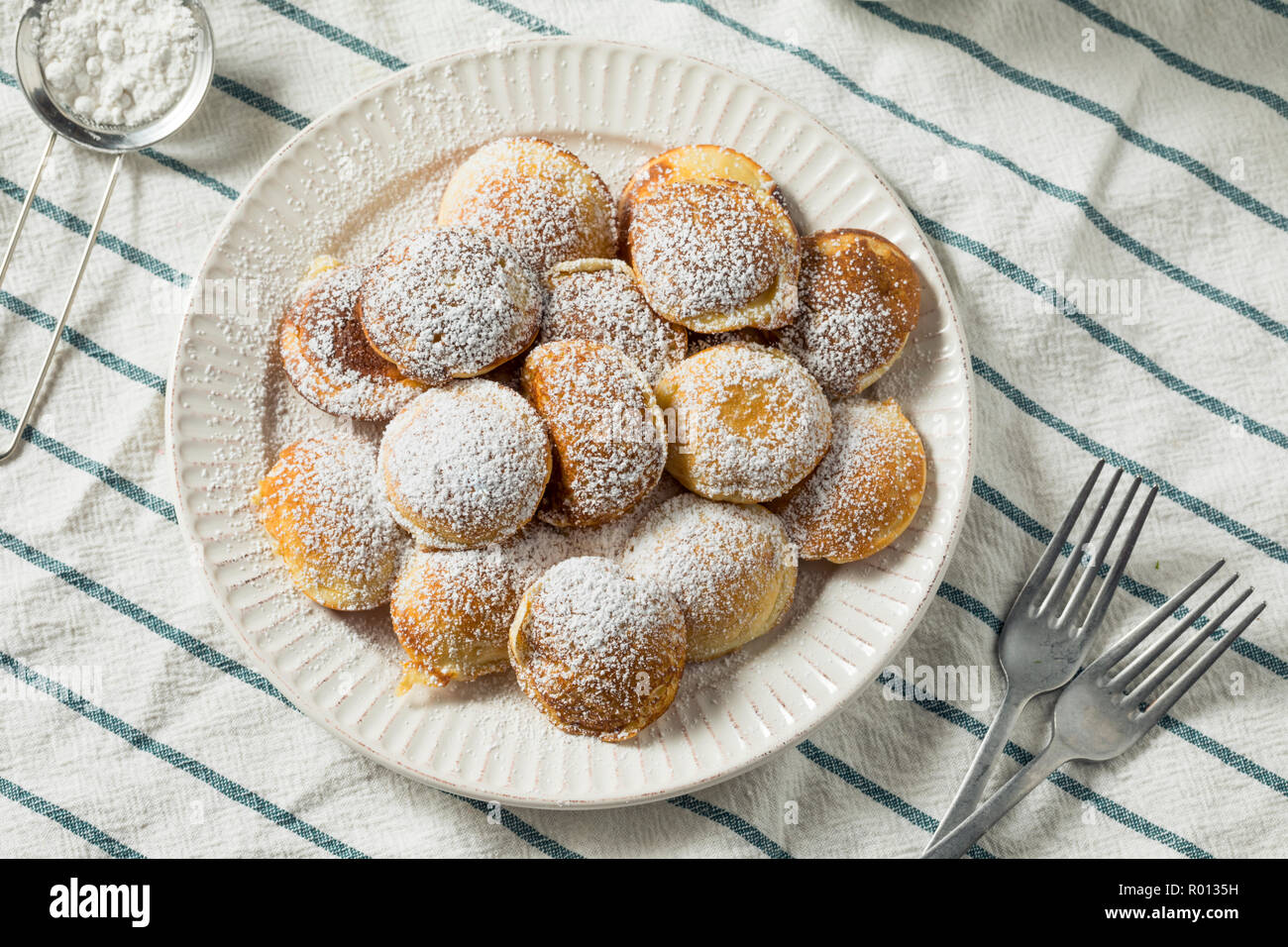 Homemade Dutch Poffertjes Pancakes with Powdered Sugar Stock Photo