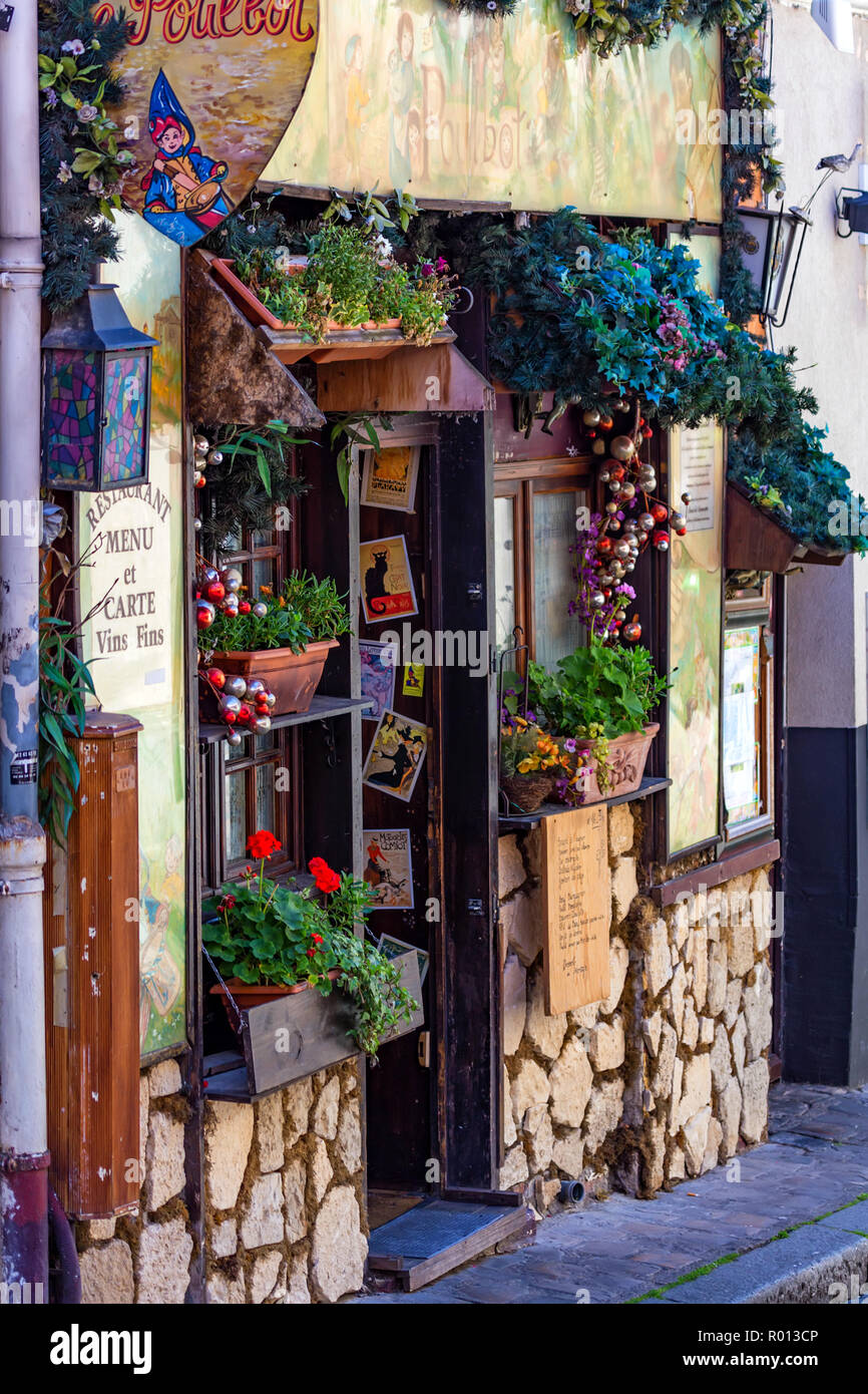 PARIS, FRANCE - JUNE 06, 2014: Cosy French cafe exterior in Paris Stock Photo