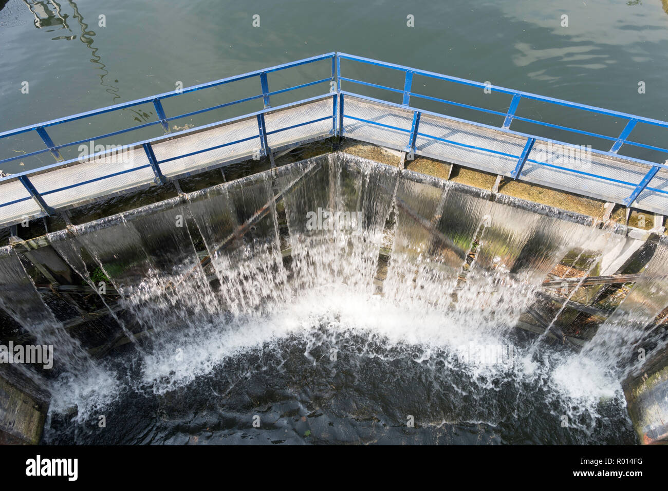Water cascading over the canal lock gates at Fontenoy sur Moselle, Meurthe-et-Moselle , France, Europe Stock Photo