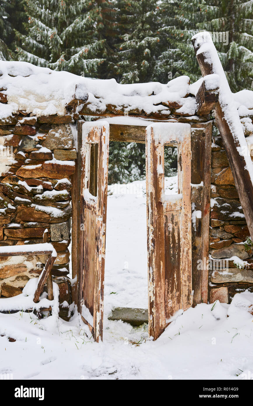 Old abandoned demolished house covered with snow in winter Stock Photo ...