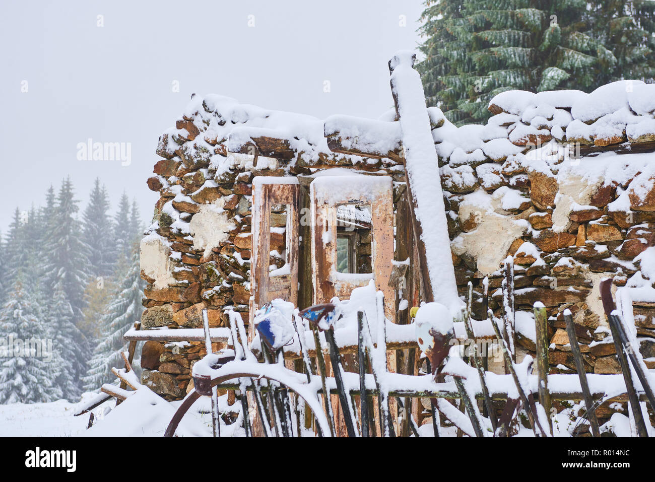 Old abandoned demolished house covered with snow in winter Stock Photo ...