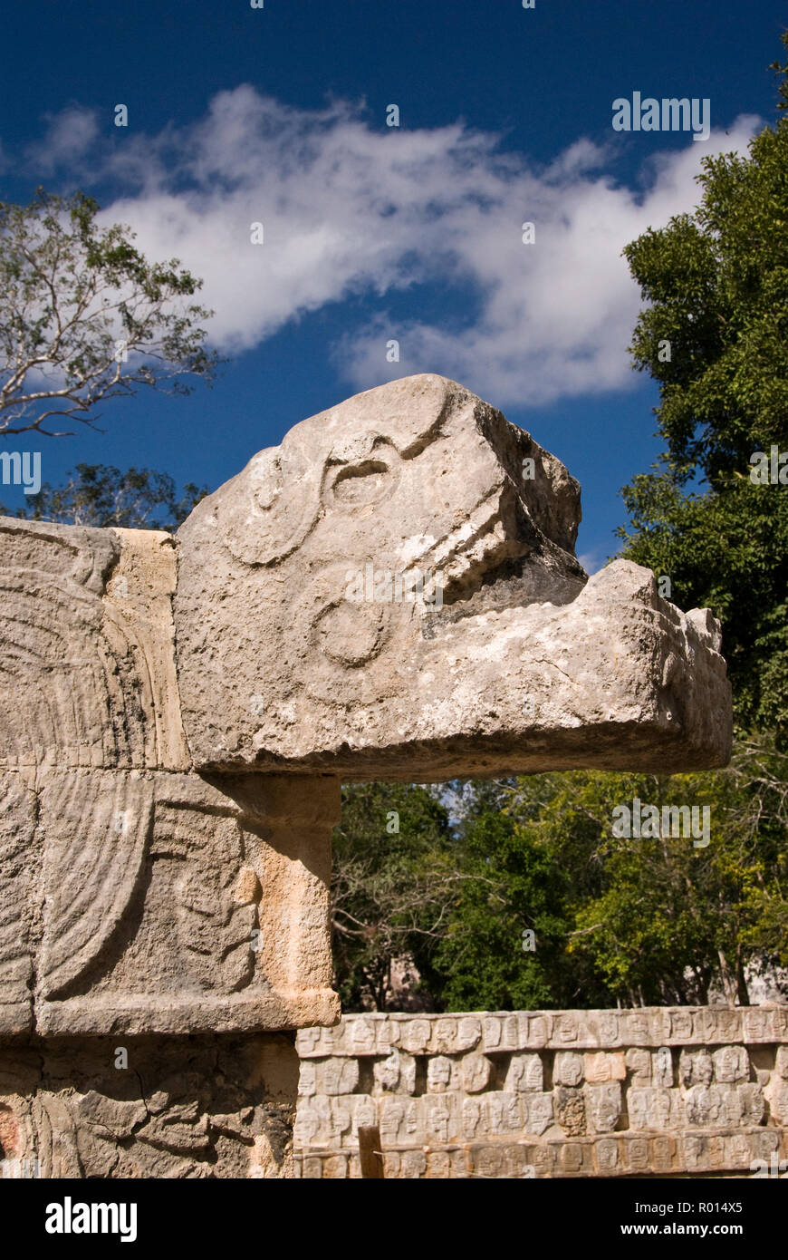 Kukulkan (Feathered Serpent), the Maya snake deity at the stone skull platform (tzompantli), Chichen Itza, Mexico. Stock Photo