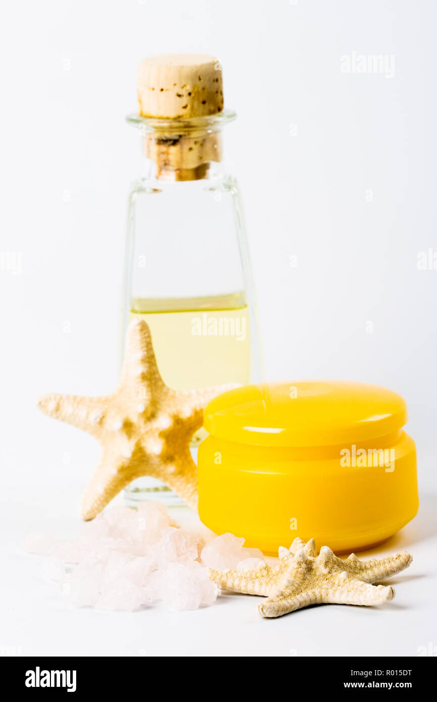 spa products sea salt, facial creme, oil and stars Stock Photo Alamy