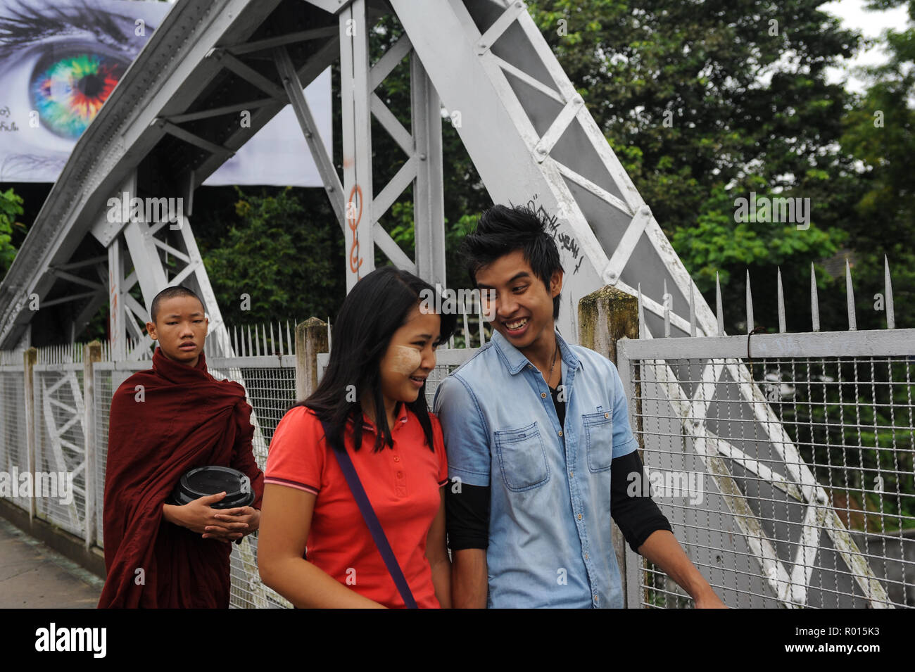 Yangon, Myanmar, eye, monk and young couple Stock Photo