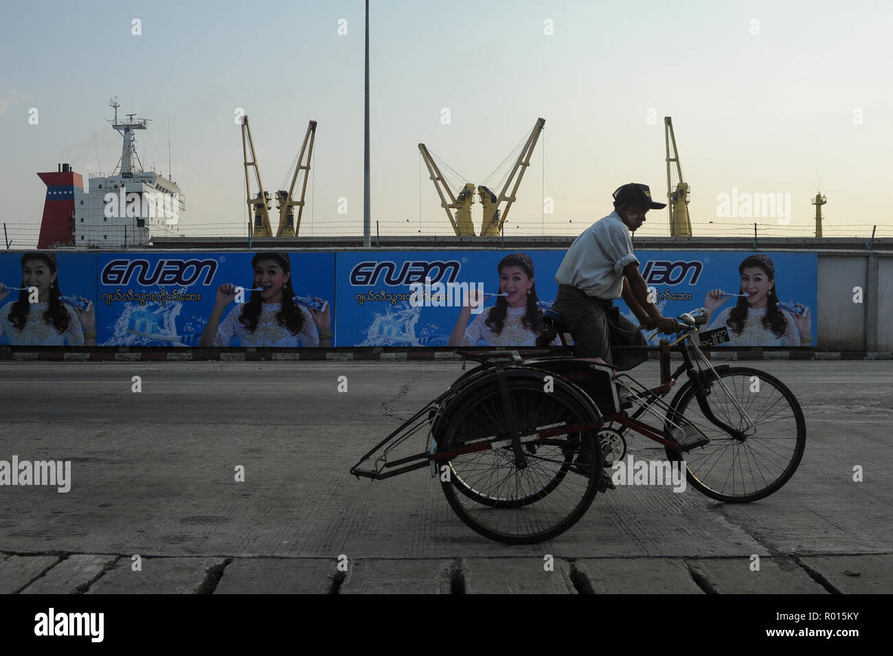 Yangon, Myanmar, Asia, bicycle rickshaw at container port Stock Photo