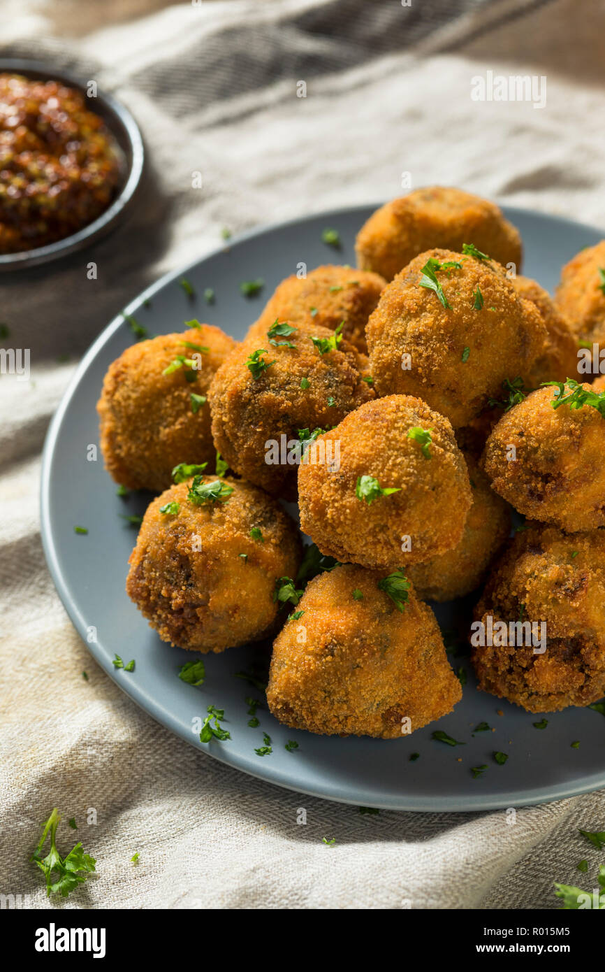 Fried Homemade Dutch Bitterballen with Spicy Mustard Stock Photo