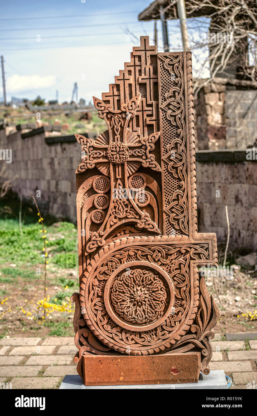 Oshakan,Armenia,19 Februar,2018: Stone cross carved with ornaments in the form of the tenth letter  of the Armenian alphabet, created by Mesrop Mashto Stock Photo