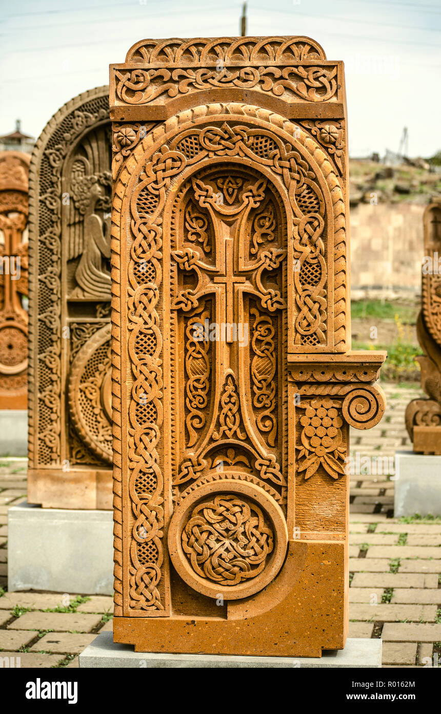 Oshakan,Armenia,19 Februar,2018: Stone cross carved with ornaments in the form of the thirty-second  letter  of the Armenian alphabet, created by Mesr Stock Photo