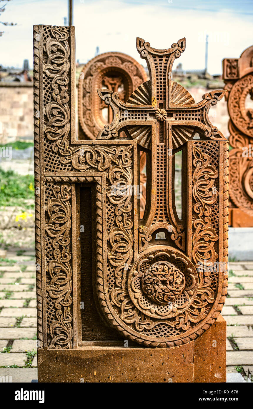 Oshakan,Armenia,19 Februar,2018: Stone cross carved with ornaments in the form of the thirteenth letter  of the Armenian alphabet, created by Mesrop M Stock Photo